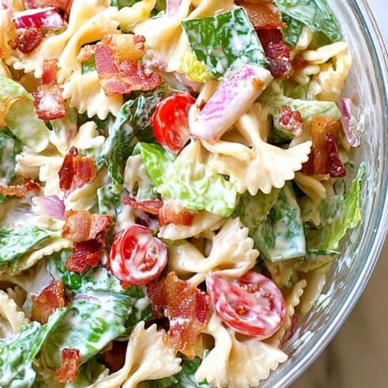 BLT Pasta Salad served in a bowl with crispy bacon, lettuce, tomatoes, and creamy dressing