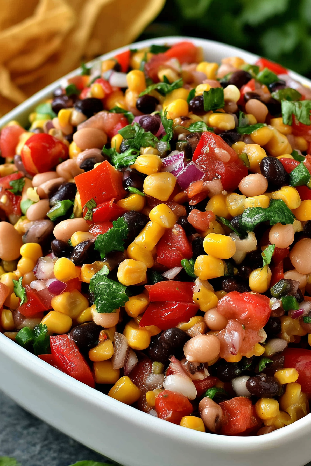 Colorful homemade Cowboy Caviar recipe served with tortilla chips