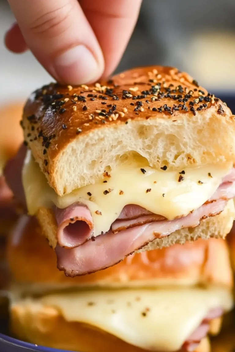 Ham and Cheese Sliders with melted cheese and buttery Hawaiian rolls