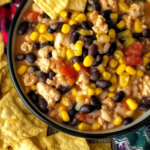High Protein Taco Soup in a creamy bowl with taco toppings