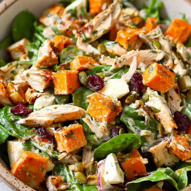 Harvest chicken sweet potato salad with roasted sweet potatoes, chicken, greens, and seasonal toppings